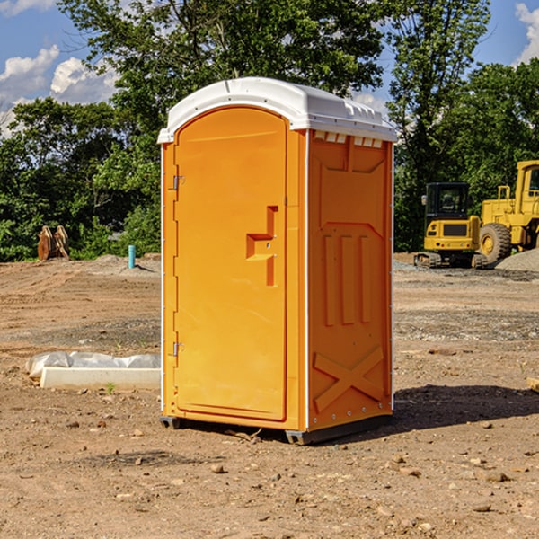 what is the cost difference between standard and deluxe portable toilet rentals in Ryland